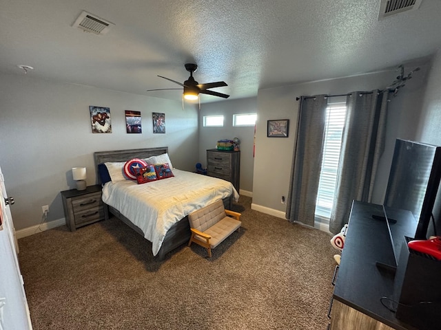 616 96th St, Odessa, TX 79765 - carpeted bedroom featuring ceiling fan and a textured ceiling