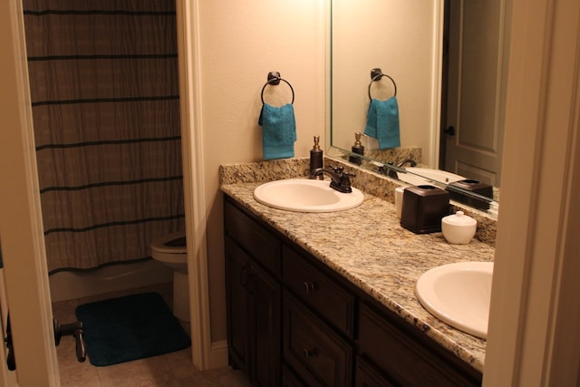 bathroom with double vanity, toilet, tile patterned floors, and curtained shower