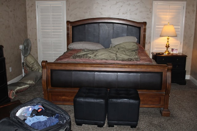 carpeted bedroom with baseboards and wallpapered walls