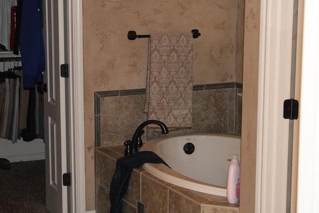 full bathroom with a bath and wallpapered walls