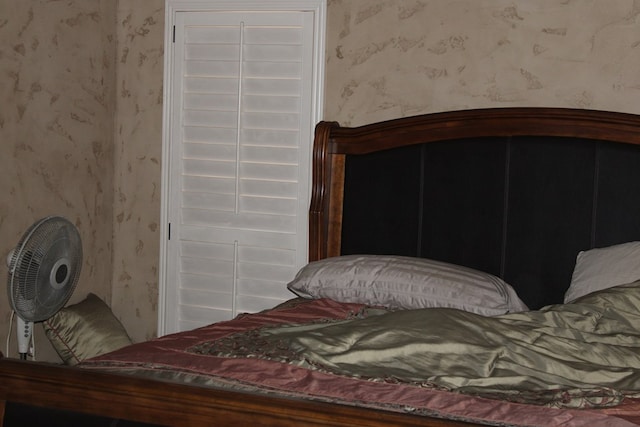 bedroom with wallpapered walls