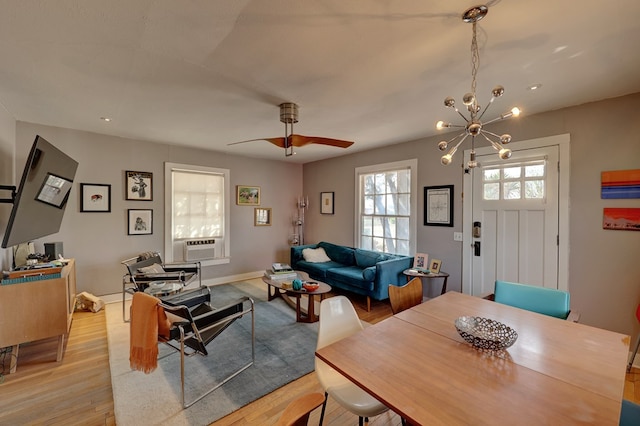 408 W 2nd St, Marfa, TX 79843 - living area with a chandelier, light wood-style floors, ceiling fan, and cooling unit
