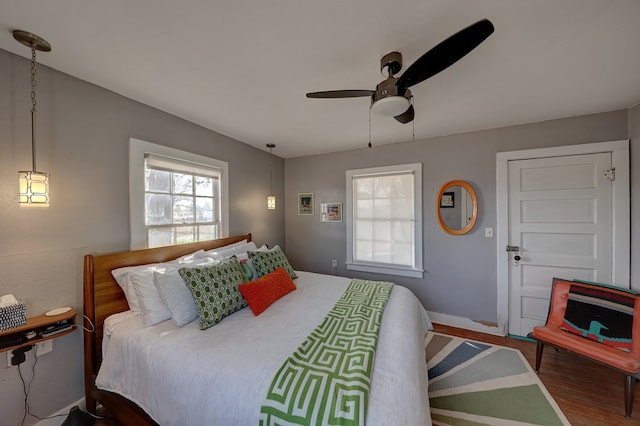 408 W 2nd St, Marfa, TX 79843 - bedroom featuring wood finished floors, ceiling fan, and baseboards