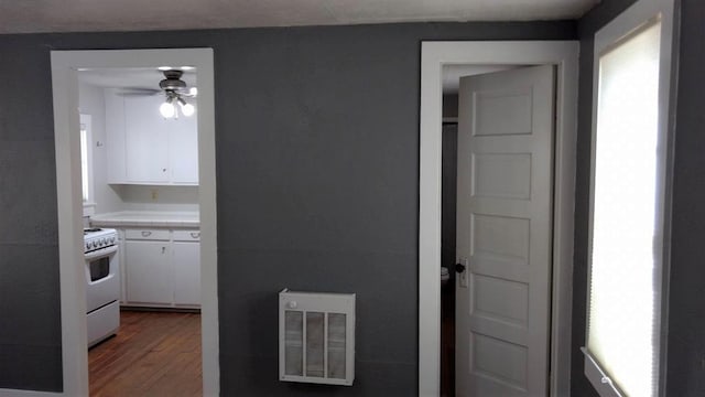 408 W 2nd St, Marfa, TX 79843 - kitchen featuring white range with electric stovetop, white cabinets, a ceiling fan, dark wood-style flooring, and tile countertops