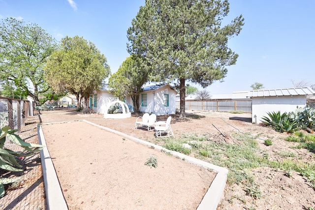 408 W 2nd St, Marfa, TX 79843 - view of yard with a bocce ball area and fence