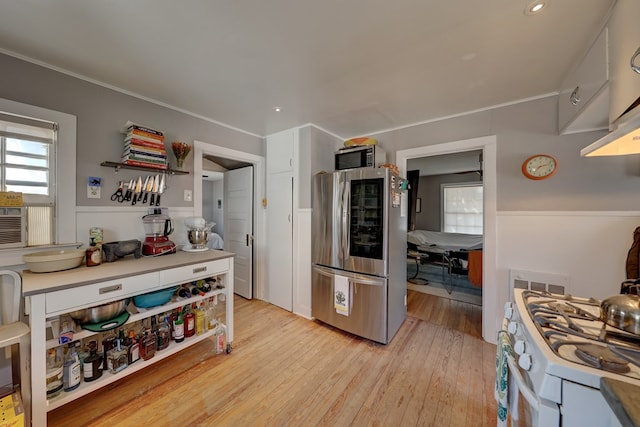 408 W 2nd St, Marfa, TX 79843 - kitchen featuring appliances with stainless steel finishes, light wood finished floors, and recessed lighting