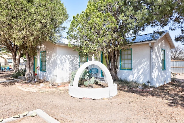 408 W 2nd St, Marfa, TX 79843 - view of front of property with stucco siding and metal roof