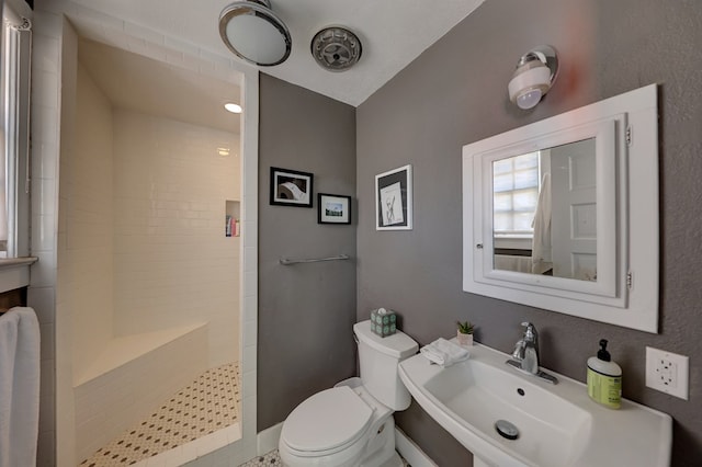 408 W 2nd St, Marfa, TX 79843 - full bath with a sink, tiled shower, and toilet
