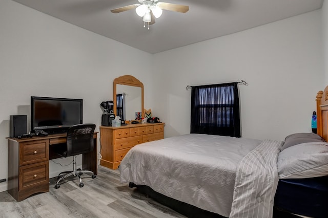 bedroom with ceiling fan and light hardwood / wood-style floors