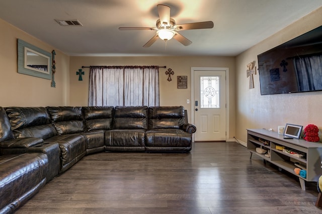 living room with ceiling fan and dark wood-type flooring