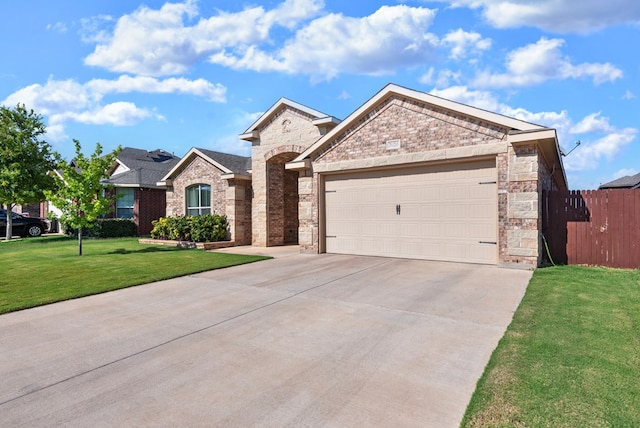 7028 Xit Ranch Rd, Odessa, TX 79765 - view of front of home featuring concrete driveway, a garage, brick siding, and stone siding