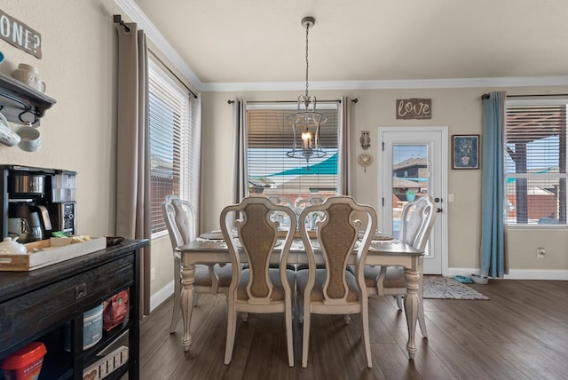 7028 Xit Ranch Rd, Odessa, TX 79765 - dining space with dark wood-style floors, ornamental molding, and a chandelier