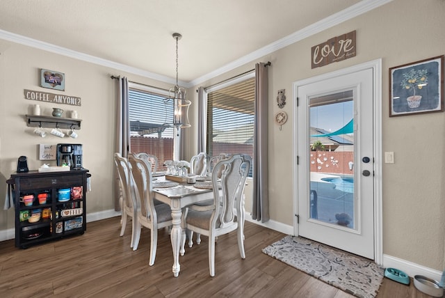 7028 Xit Ranch Rd, Odessa, TX 79765 - dining area featuring crown molding and wood finished floors