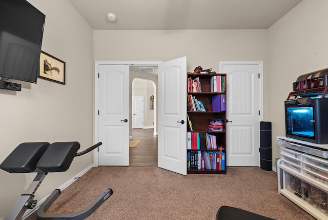 7028 Xit Ranch Rd, Odessa, TX 79765 - workout room with carpet floors and arched walkways