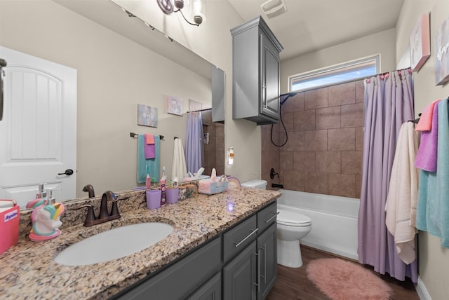 7028 Xit Ranch Rd, Odessa, TX 79765 - bathroom featuring vanity, wood finished floors, and shower / tub combo with curtain