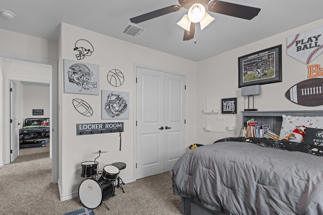 bedroom featuring carpet, a ceiling fan, a closet, visible vents, and baseboards