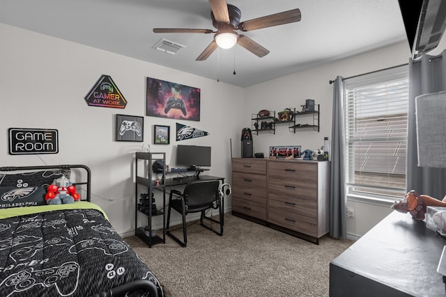 carpeted bedroom featuring ceiling fan, baseboards, and visible vents