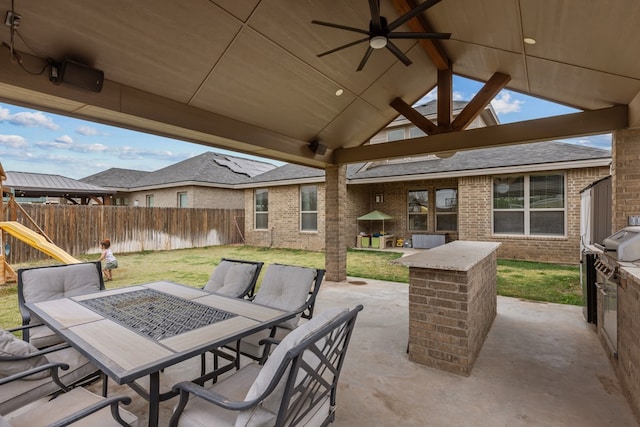 view of patio featuring a ceiling fan, outdoor dining space, a playground, a gazebo, and a fenced backyard