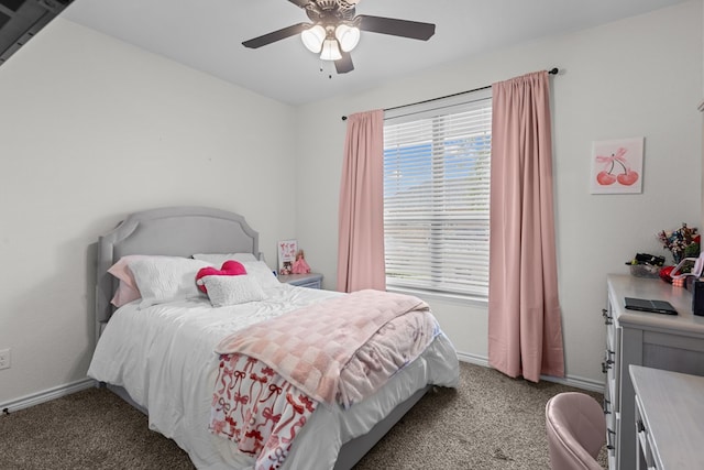carpeted bedroom featuring baseboards and ceiling fan