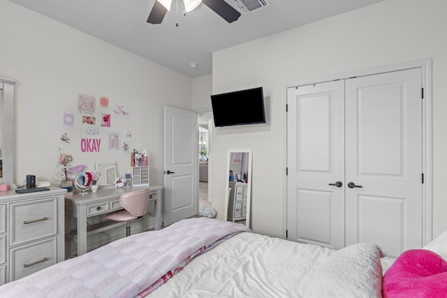 bedroom with a closet, visible vents, and ceiling fan