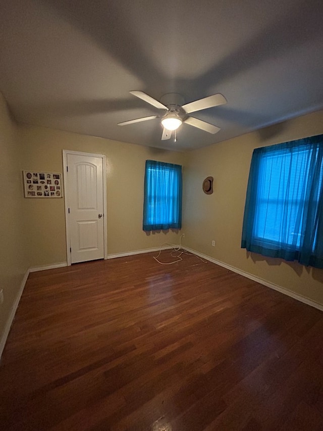 414 E 45th St, Odessa, TX 79762 - empty room with wood finished floors, a ceiling fan, and baseboards