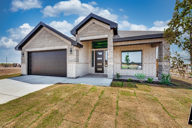 8620 Santa Isabella St, Odessa, TX 79765 - view of front facade with driveway, an attached garage, a front yard, and brick siding