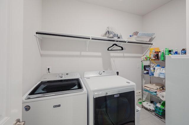 7521 Iron Mountain Rd, Odessa, TX 79765 - laundry room with washer and clothes dryer and tile patterned floors