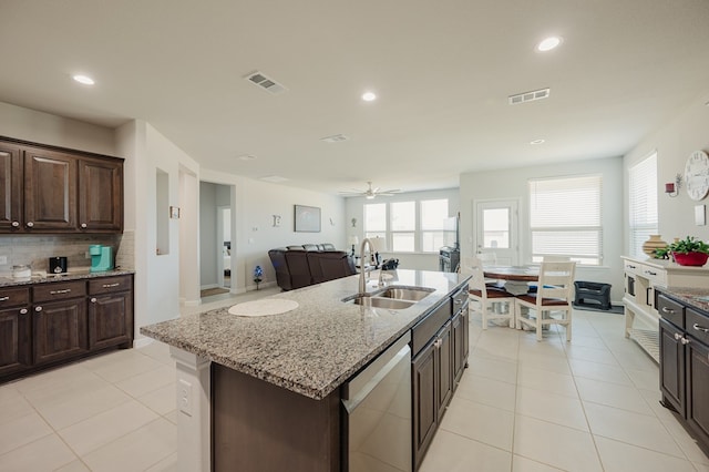 7521 Iron Mountain Rd, Odessa, TX 79765 - kitchen featuring a sink, dishwasher, recessed lighting, tasteful backsplash, and light tile patterned flooring