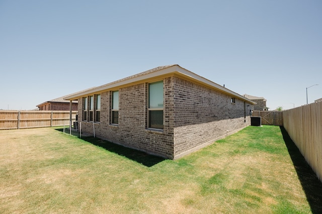 7521 Iron Mountain Rd, Odessa, TX 79765 - view of property exterior featuring brick siding and central AC