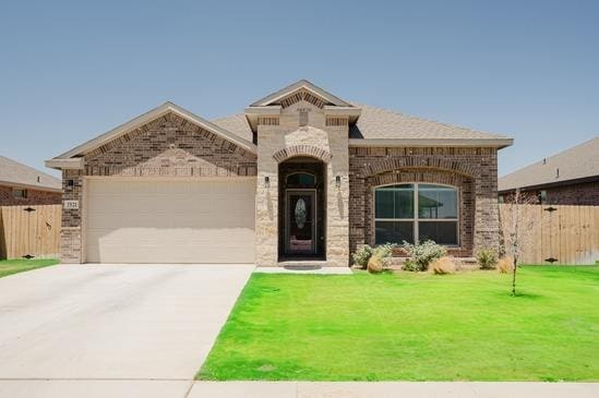 7521 Iron Mountain Rd, Odessa, TX 79765 - french country home featuring brick siding, a garage, and concrete driveway