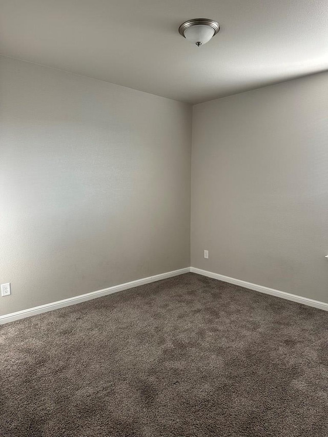 3117 Blue Quail Ct, Midland, TX 79705 - spare room with dark carpet and baseboards