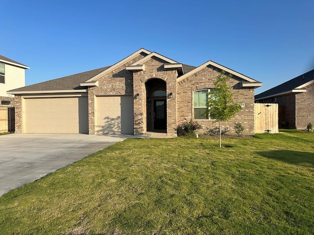 3117 Blue Quail Ct, Midland, TX 79705 - view of front of home with a garage, driveway, and brick siding