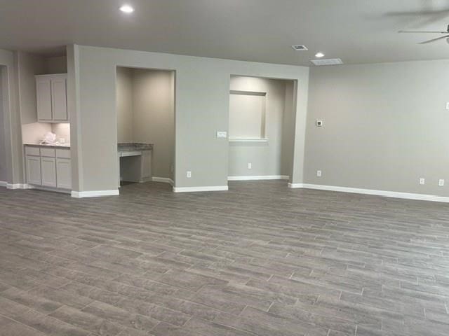 3117 Blue Quail Ct, Midland, TX 79705 - unfurnished living room featuring a ceiling fan, baseboards, wood finished floors, and recessed lighting