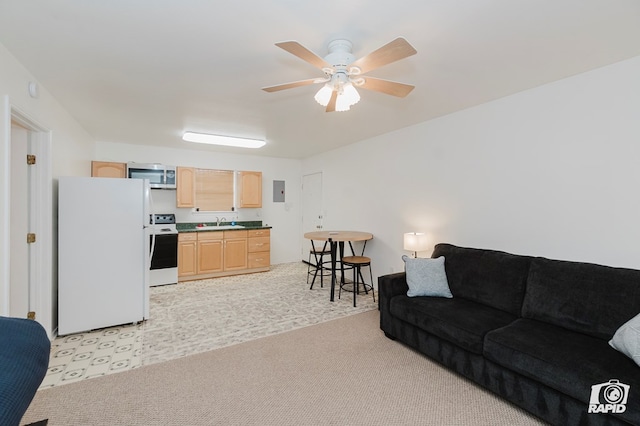 living room with ceiling fan and light colored carpet