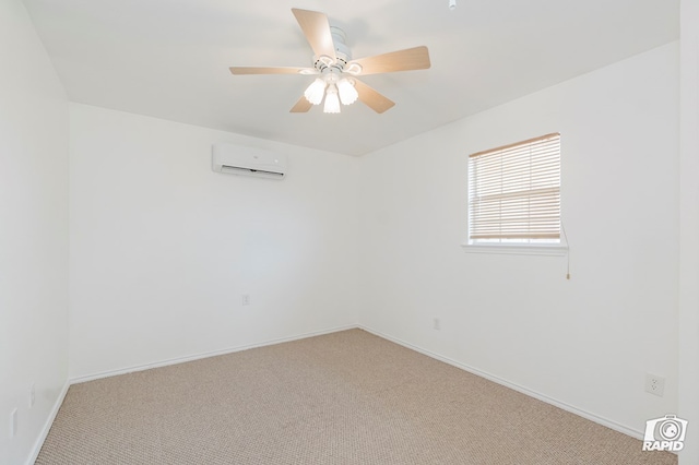 carpeted spare room featuring a ceiling fan, baseboards, and an AC wall unit
