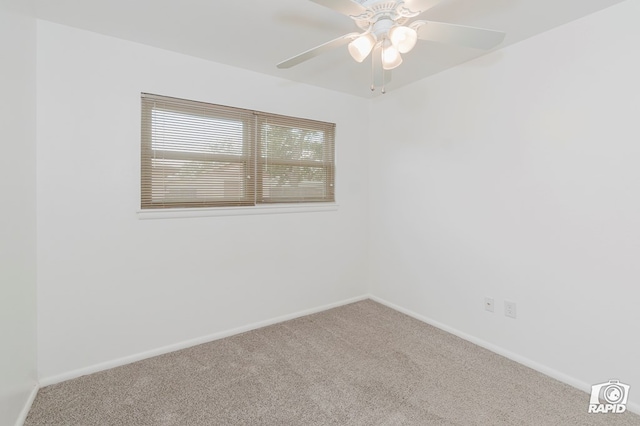 empty room featuring carpet flooring, baseboards, and ceiling fan