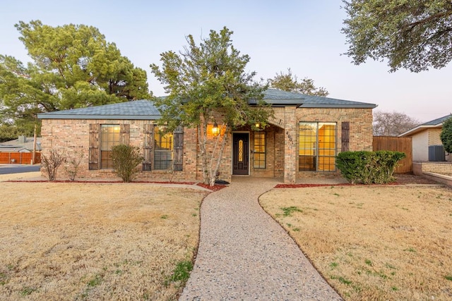 4001 Dyer Cir, Midland, TX 79707 - ranch-style house featuring brick siding and fence