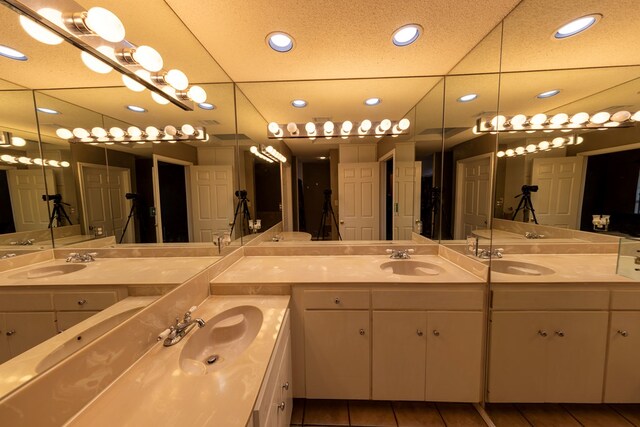 4001 Dyer Cir, Midland, TX 79707 - full bath with double vanity, recessed lighting, and tile patterned flooring