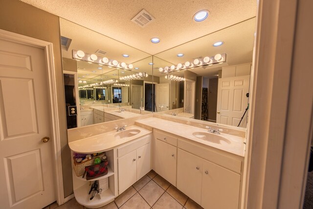 4001 Dyer Cir, Midland, TX 79707 - full bath featuring tile patterned flooring, recessed lighting, vanity, and a textured ceiling