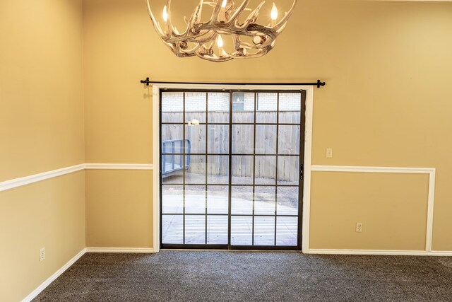 4001 Dyer Cir, Midland, TX 79707 - unfurnished room with a chandelier, carpet floors, and baseboards