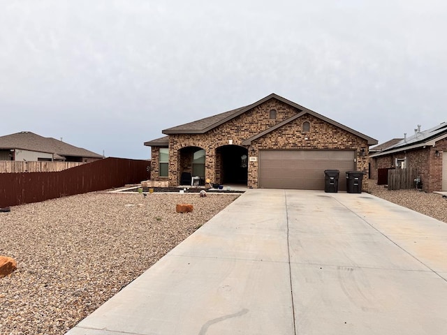 1506 Buffalo Gap, Midland, TX 79705 - view of front of home featuring driveway and an attached garage