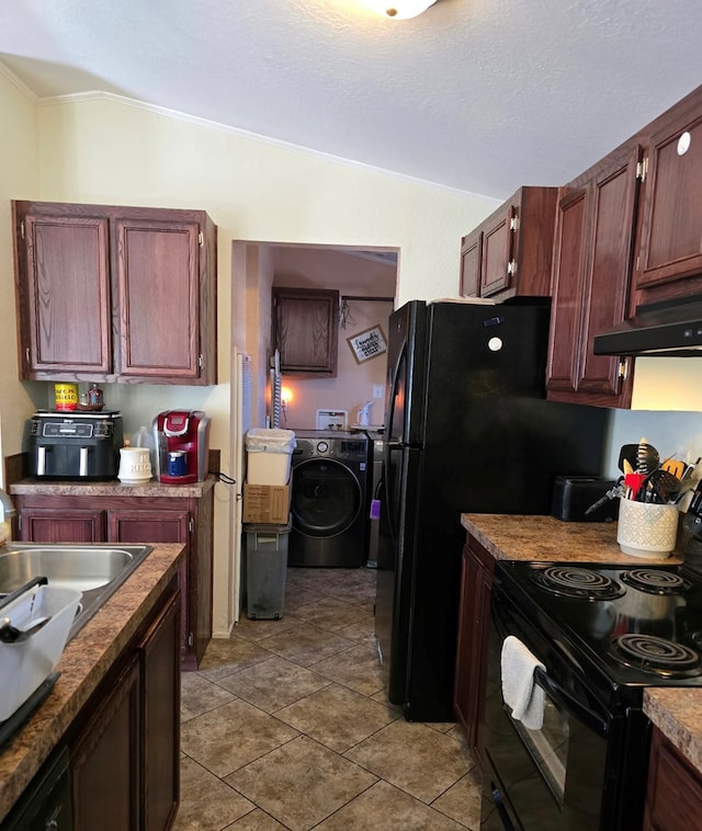 kitchen featuring lofted ceiling, light tile patterned flooring, black appliances, under cabinet range hood, and a textured ceiling