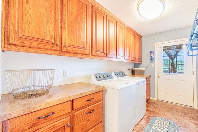 404 SW 21st St, Seminole, TX 79360 - washroom featuring cabinet space, washing machine and clothes dryer, light tile patterned flooring, and a textured ceiling