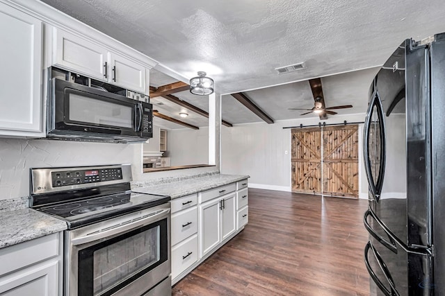 14038 W County Rd 123, Odessa, TX 79765 - kitchen featuring black appliances, a barn door, white cabinetry, dark wood-style flooring, and a textured ceiling