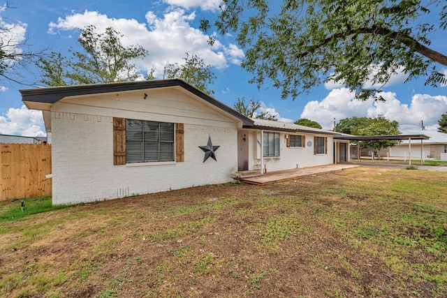 14038 W County Rd 123, Odessa, TX 79765 - ranch-style home with a carport and brick siding