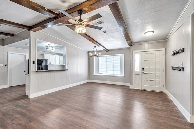 14038 W County Rd 123, Odessa, TX 79765 - entrance foyer with dark wood-type flooring, a chandelier, beam ceiling, a ceiling fan, and wooden walls