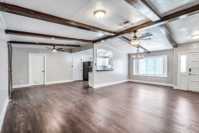 14038 W County Rd 123, Odessa, TX 79765 - unfurnished living room featuring a ceiling fan, dark wood finished floors, a chandelier, and a textured ceiling