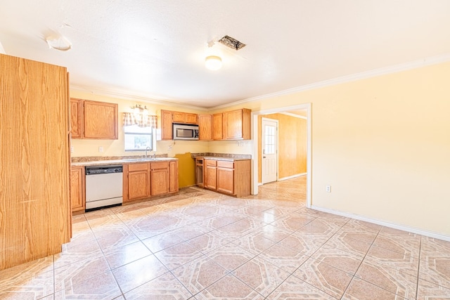kitchen with light countertops, a sink, crown molding, stainless steel microwave, and dishwasher