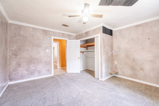 unfurnished bedroom with carpet flooring, a closet, visible vents, and a textured ceiling