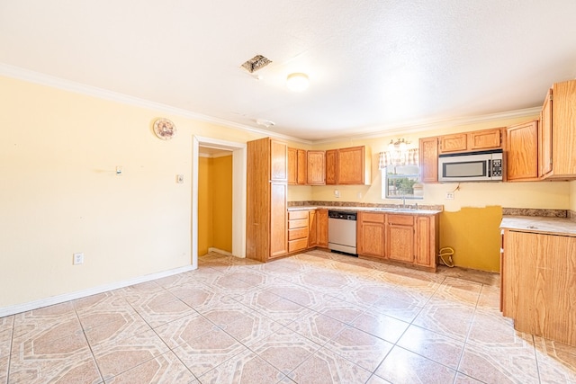 kitchen with a sink, stainless steel appliances, crown molding, light countertops, and light tile patterned floors